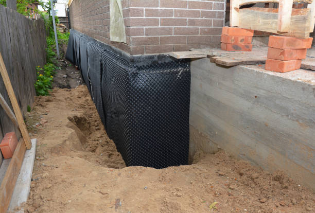 Happy homeowners after waterproofing job in Wawaka